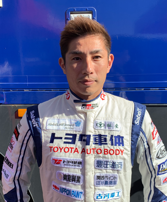 Team 1, Car 246 Driver Akira Miura looking to camera